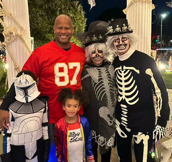 Louellen & Darryl Berger who created terror swift themed halloween decoration in 2024, greeting trick-or-treaters in 2023.